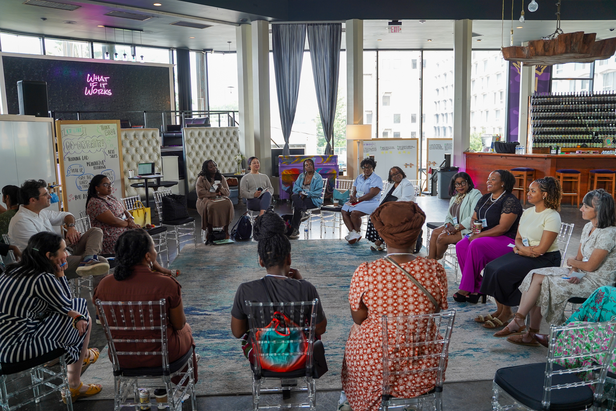 Team working through a challenge together in a circle discussion